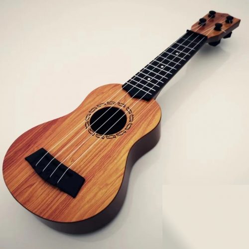 une guitare pour enfant, instrument de la musique