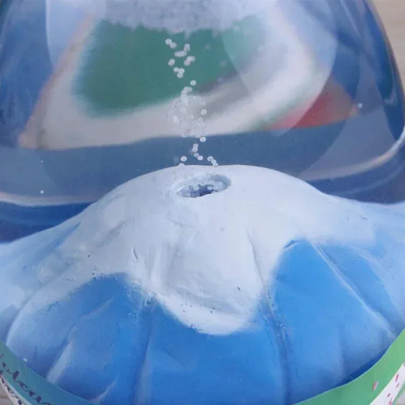 Gouttes d'huile colorée descendant lentement dans un timer liquide sensoriel