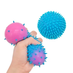 Compression d'une balle hérisson souple bleue à picots – stimulation proprioceptive intense